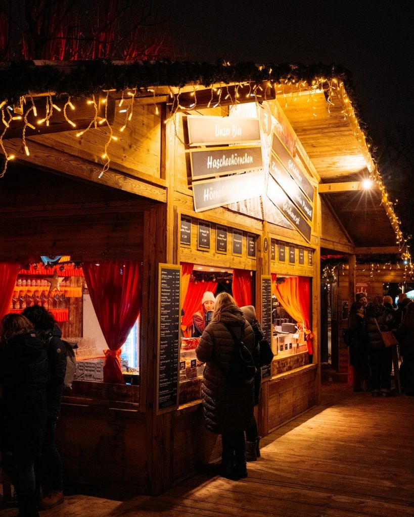 A First-Timer's Guide to Visiting Vienna Christmas Markets - Altes AKH Christmas market - Vienna Weihnachtsdorf Campus Universitat Wien Food Stall